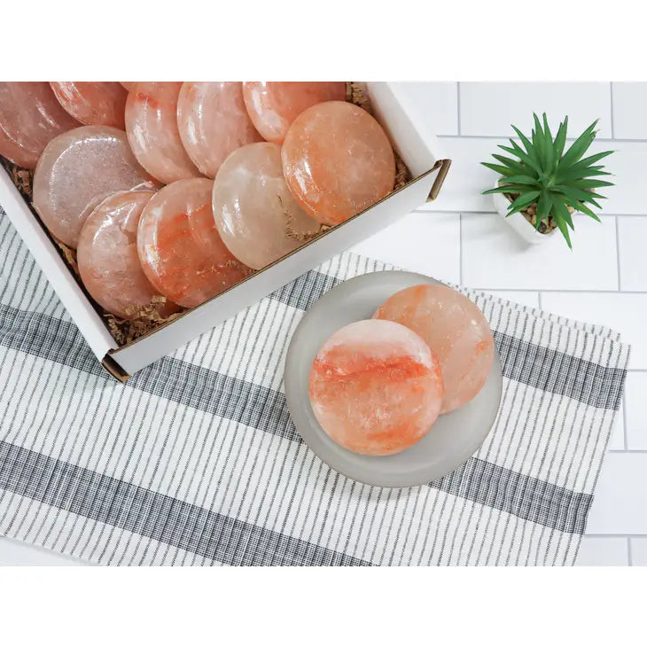 Box and bowl of shrimp next to Himalayan Salt Round Disk For Massage #LV3588