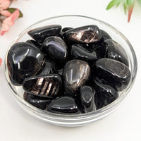 Polished black obsidian stones in a bowl for Hyperstene 1 1.6 A+ Tumbled Stone LV8053