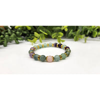 Multicolored Inner Peace beaded bracelet with gold accents, purple beads