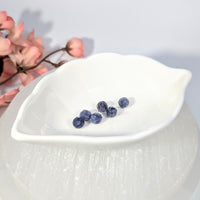 Five deep blue sapphire beads in leaf-shaped dish, iolite parcel #BC0689