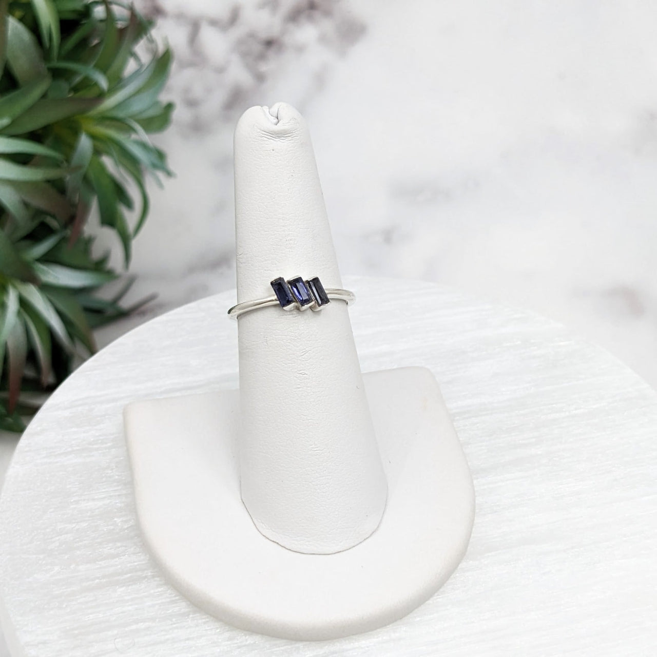 White sterling silver ring with blue sapphire stone from Iolite’s collection, size 6-8