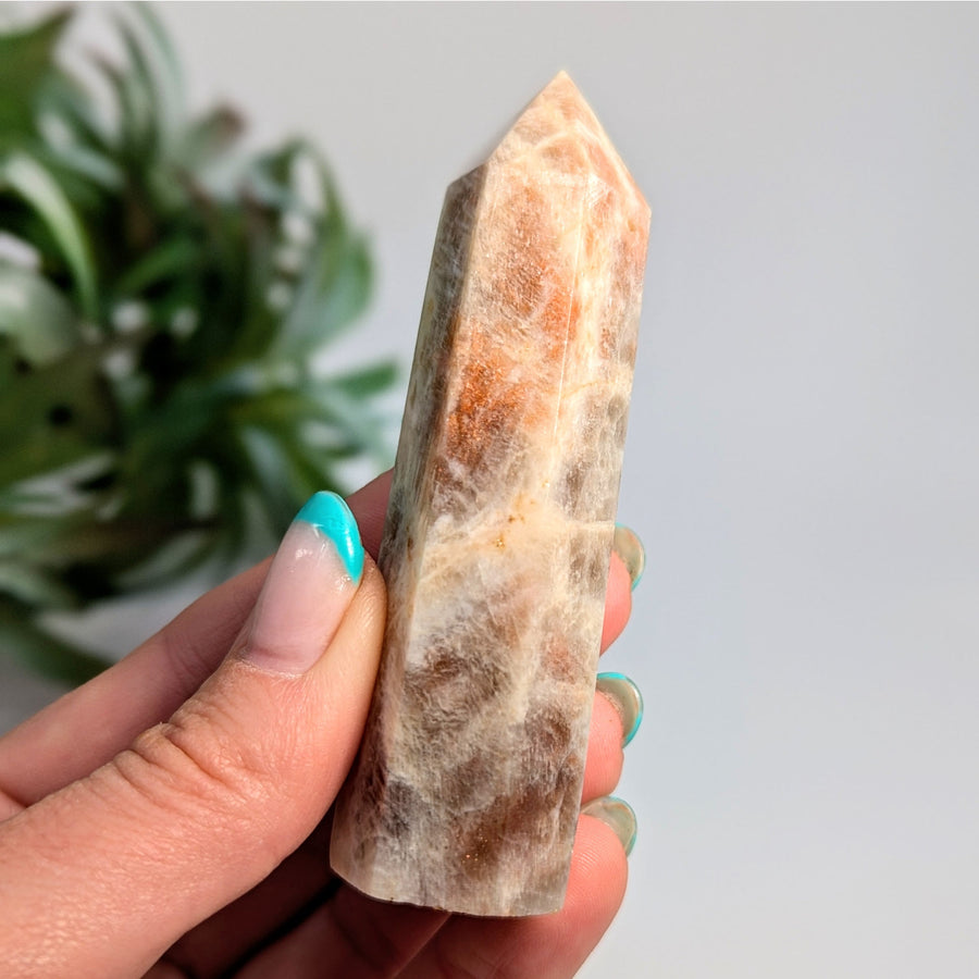 Polished sunstone crystal point from Irridescent Sunfire Moonstone Tower Bliss Crystals