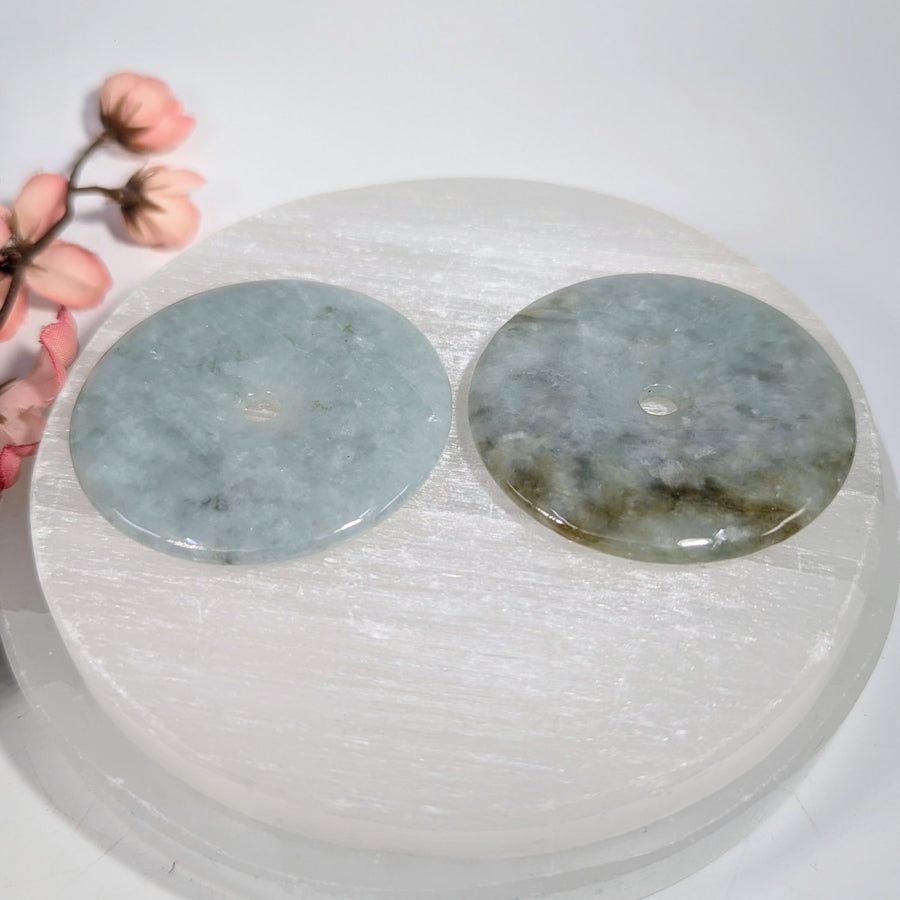 Two 2.1-inch jade donut pendants: light blue and greenish-gray veining, #BC0166