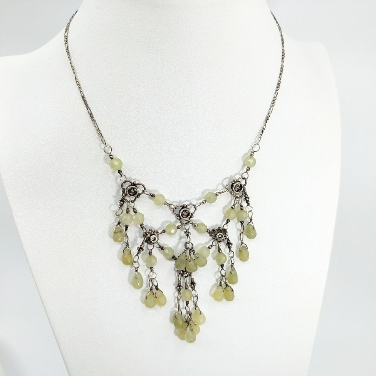 Ornate silver Jade Briolette 15’’ Triangle Necklace with pale green stones and floral accents