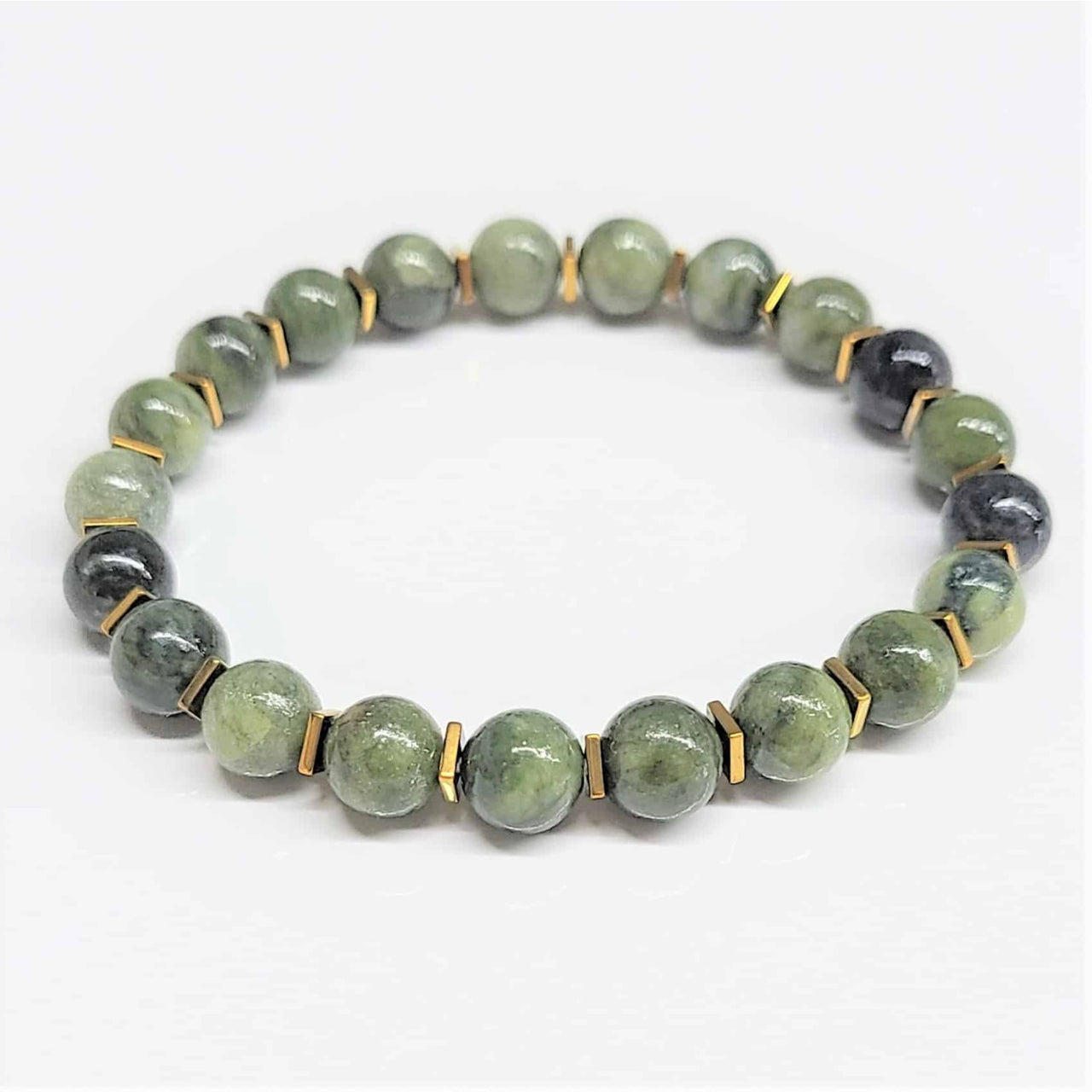 A jade gold spacer 7 inch 8mm beaded bracelet with round polished green and dark gray stones and gold-toned spacers