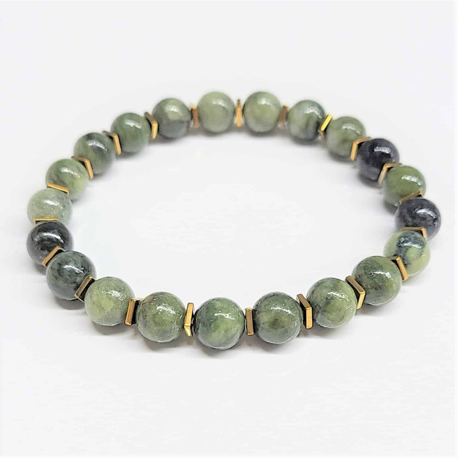 A jade gold spacer 7 inch 8mm beaded bracelet with round polished green and dark gray stones and gold-toned spacers