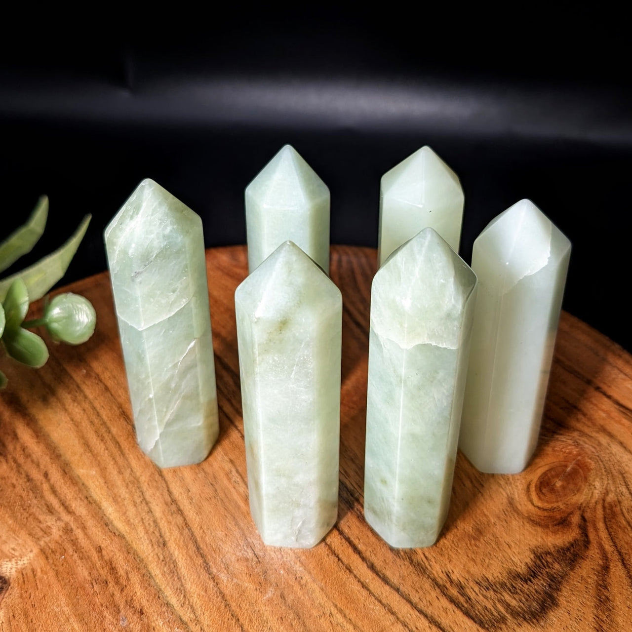 Jade Green 2.5’-2.6’ Tower #LV2170 on wooden table with three green jade points