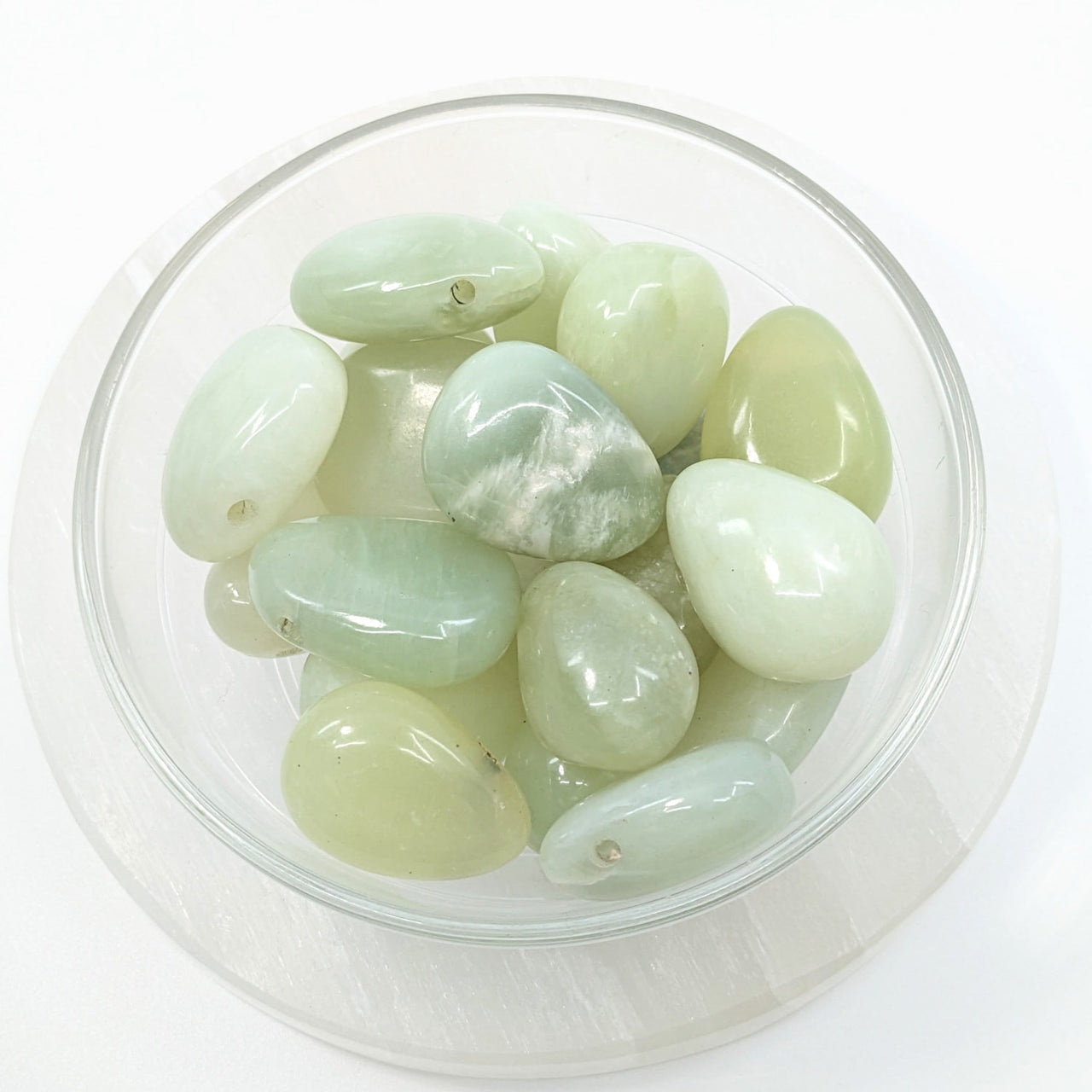 Bowl filled with green jade pebbles for Jade Green Teardrop Pendant #LV1857