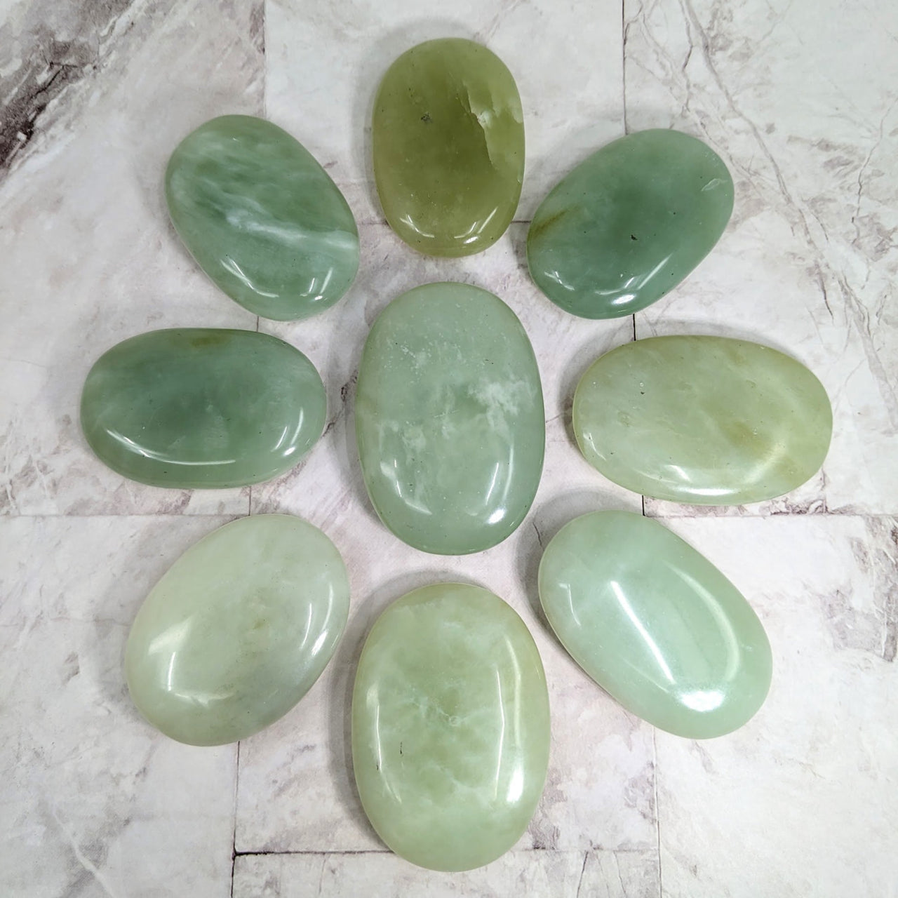 A group of green jade palm stones from the Jade Jumbo Palm Stone collection item #LV2263