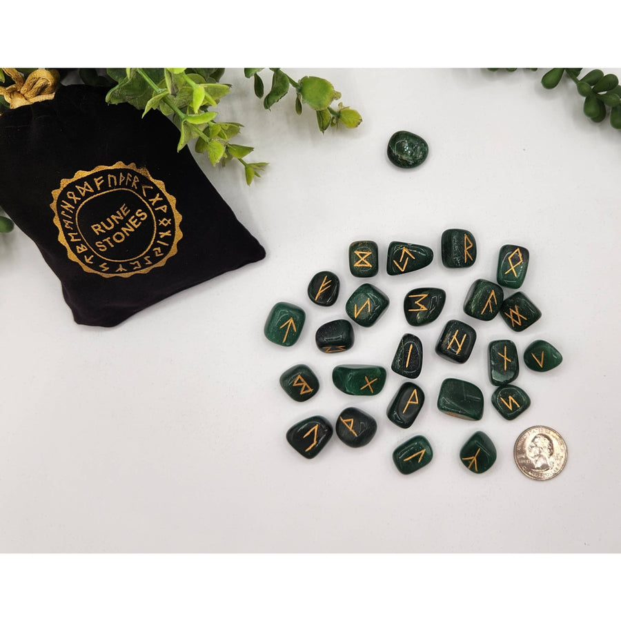 Green malachite rune stone set with gold inscriptions in black bag