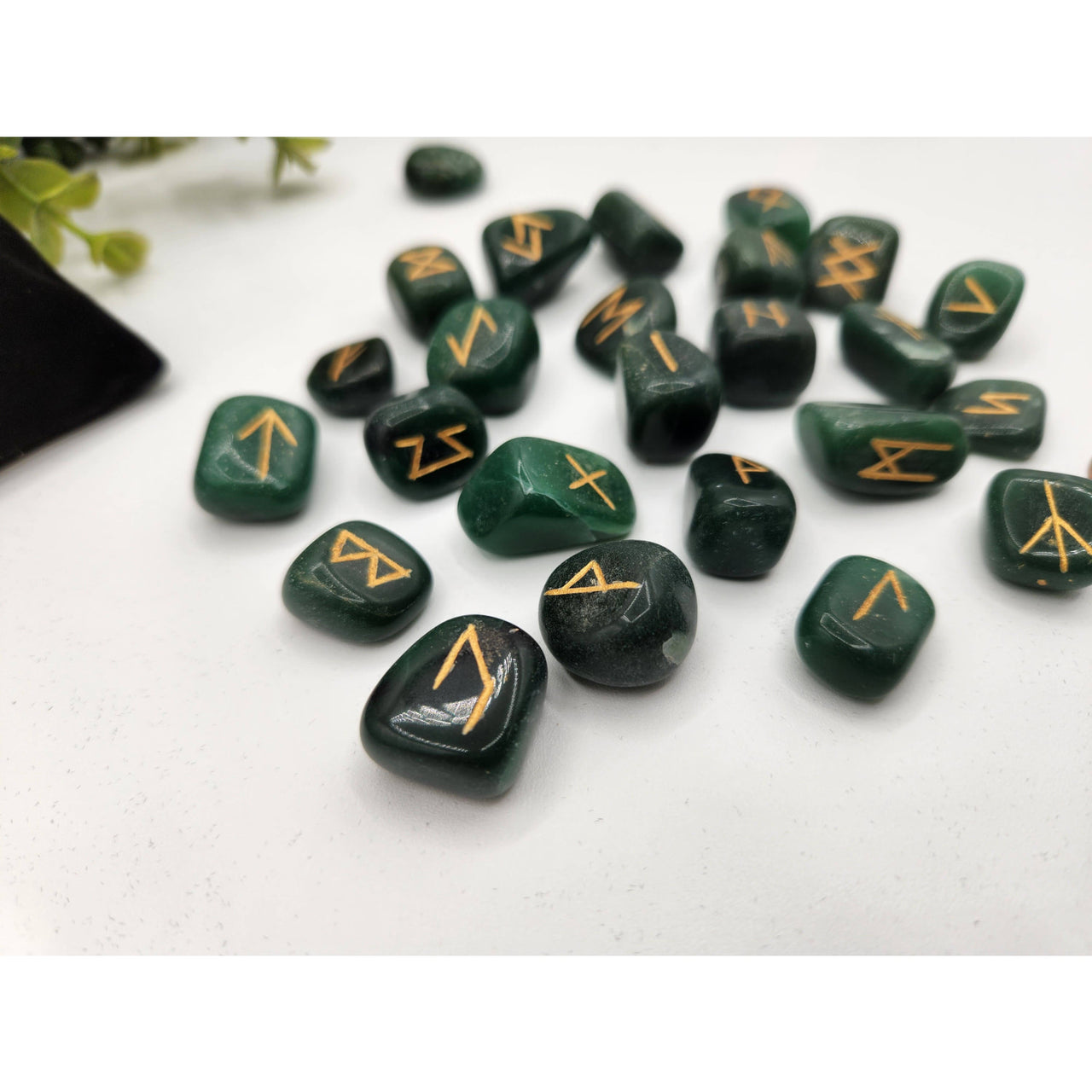 Jade rune set with green stones, gold markings, and velvet pouch LV9506