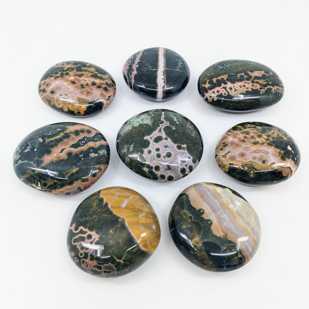 A selection of ocean jasper pebbles from Kabamby showcasing exquisite natural stone textures