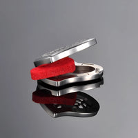 Silver heart-shaped car air freshener with red foam insert