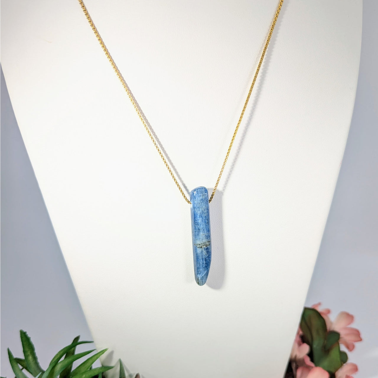 Blue Kyanite crystal pendant necklace on a gold plated chain, 18 inches long