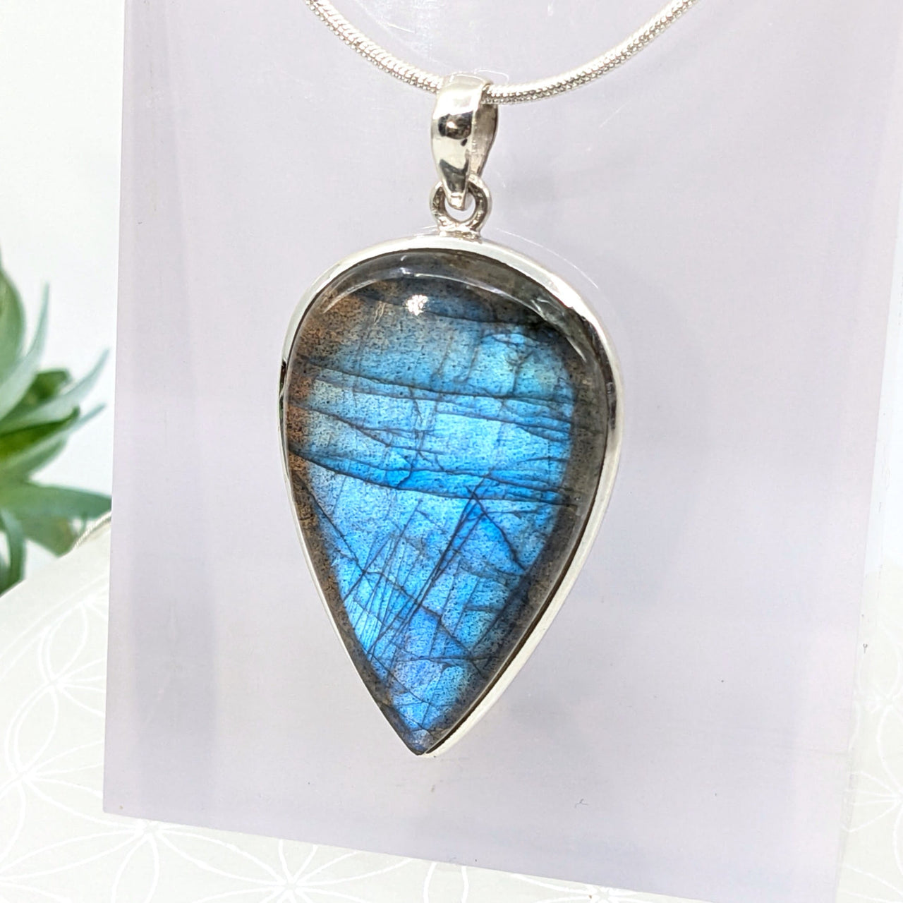 Teardrop labradorite pendant with blue iridescence in sterling silver for healing crystals