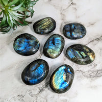 Thumbnail for Close up of six medium labradorite palm stones on marble - Labradorite Palm Stone #LV4217