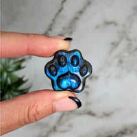Thumbnail for Hand holding Labradorite 1’ Paw Print Ring, blue and black tones, product #LV4163