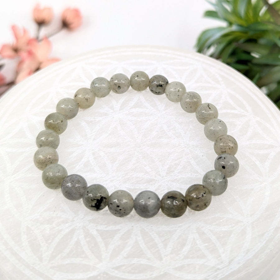 Gray beaded bracelet featuring Labradorite stones on a 7-inch adjustable strand