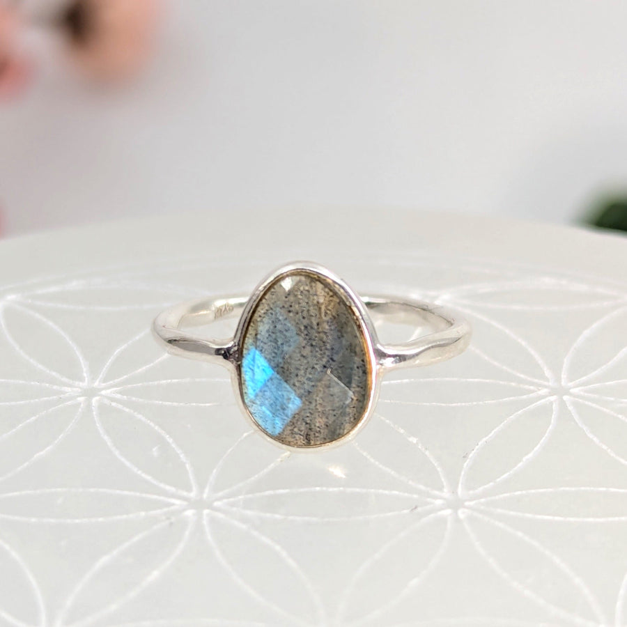 Silver ring featuring a teardrop labradorite gemstone in the Labradorite Faceted Dainty S.S. Ring