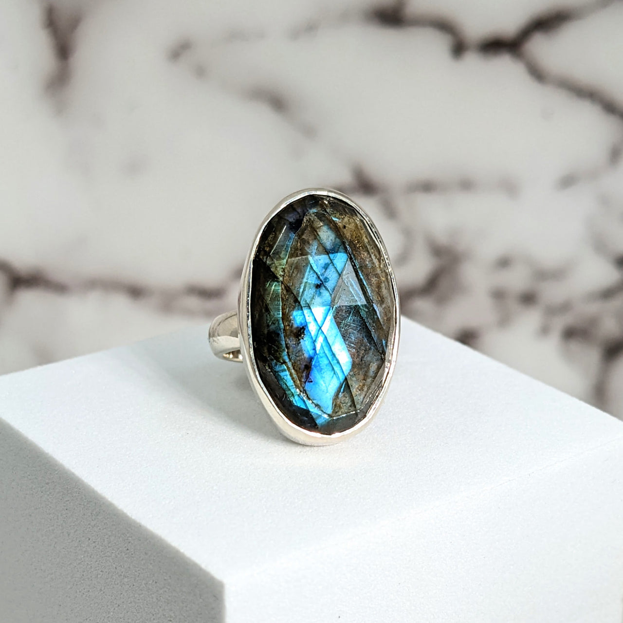 Close-up of Labradorite Faceted Sz 5.5 Oval SS Ring #SK9520 with a stunning labradorite stone