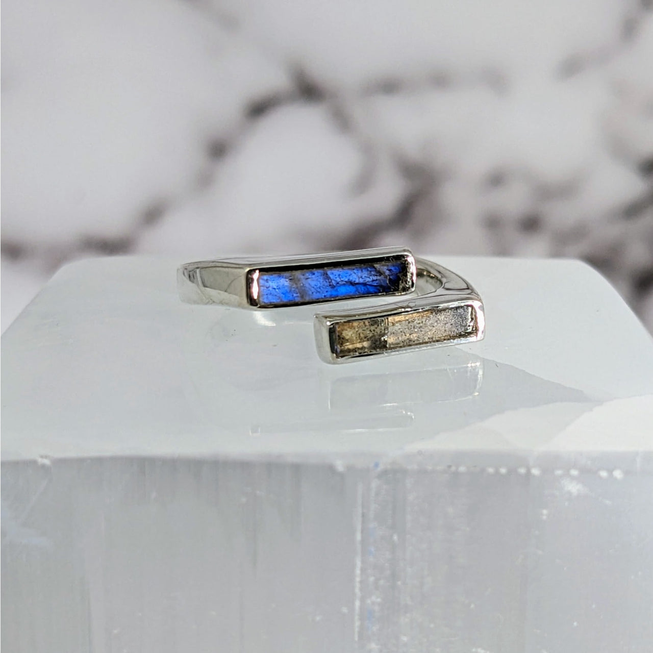 Blue Labradorite Stone Ring on White Marble Block - Product: Labradorite S.S. Split Bar Ring