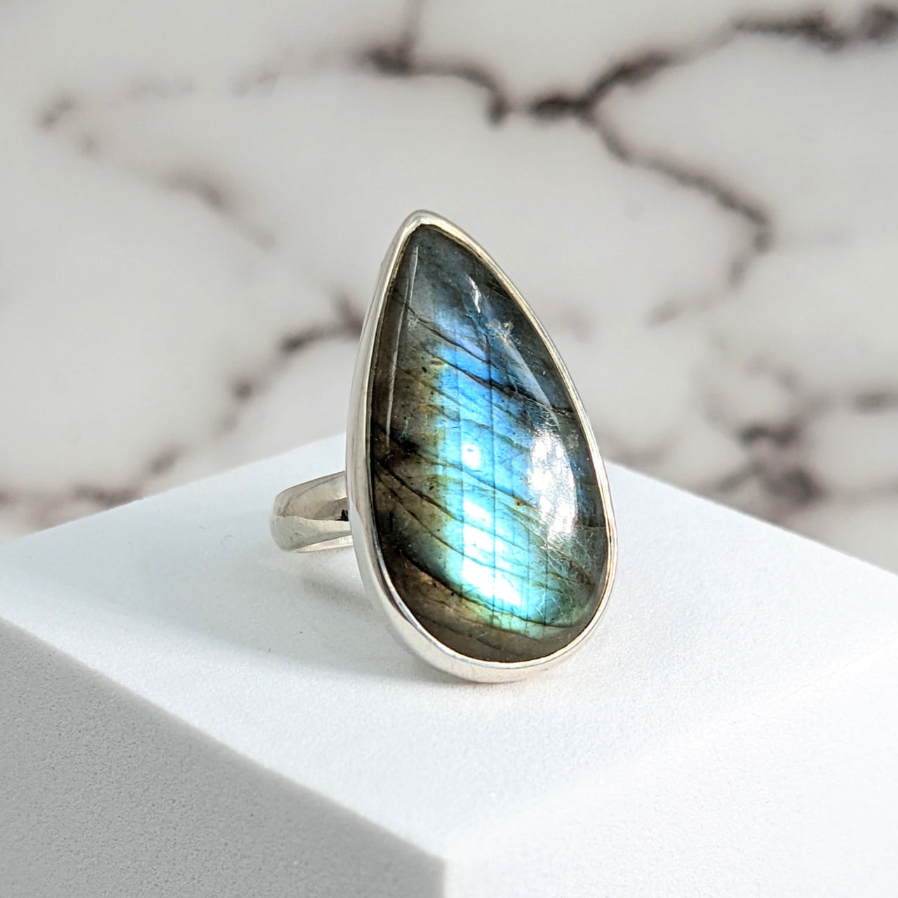 Close-up of Labradorite Sz 7.75 Teardrop SS Ring #SK9538 with iridescent stone