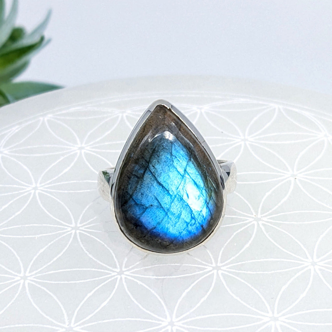 Teardrop ring featuring a blue flash labradorite gemstone set in silver, size 8.5