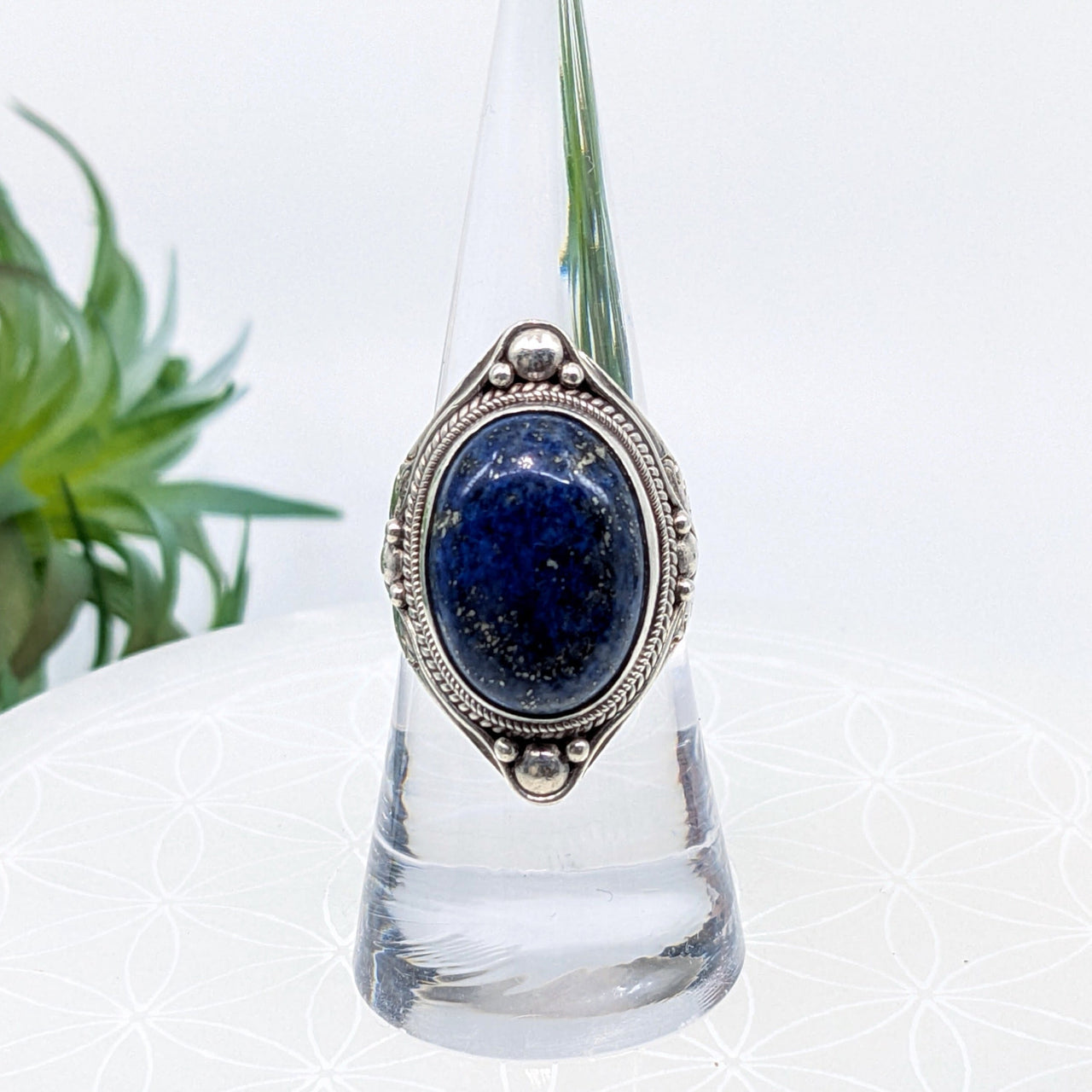 Ornate ring with oval lapis lazuli stone in antique-style silver setting