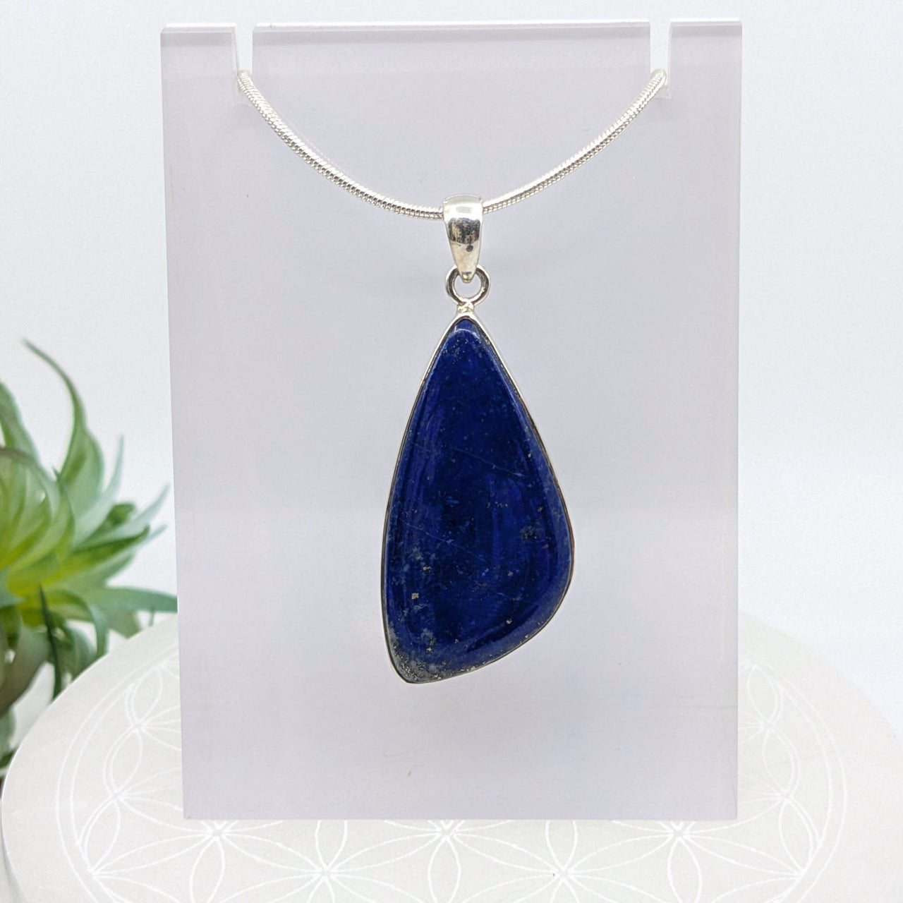 Deep blue Lapis Lazuli organic pendant on a silver chain, product #LV7062