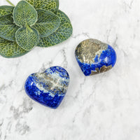 Thumbnail for Lapis Lazuli heart glass pebbles in blue and gold on white marble background #LV5742