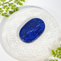 Smooth oval lapis lazuli 2.3 inch palm stone BC1160 with golden flecks