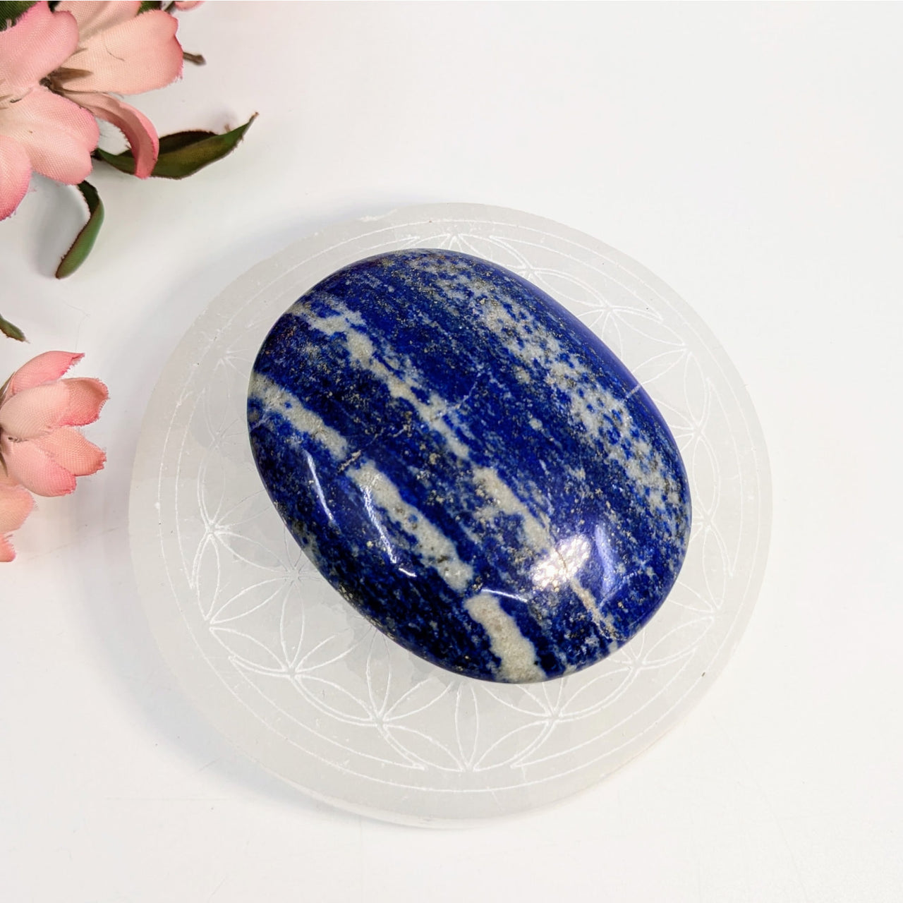 Polished Lapis Lazuli Palm Stone featuring white striations, #LV6947