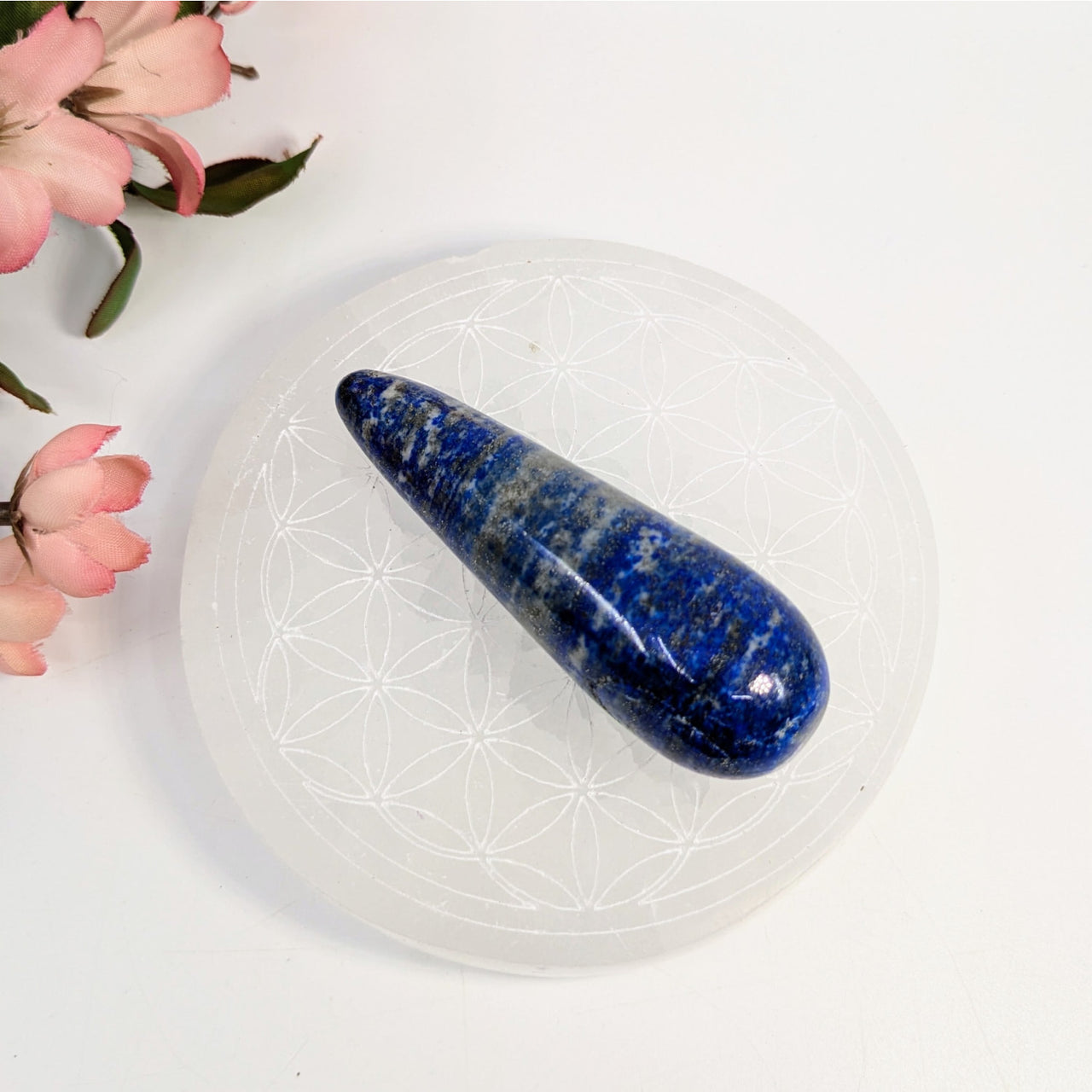 Polished Lapis Lazuli wand with deep blue color and gold inclusions for item tier benefits