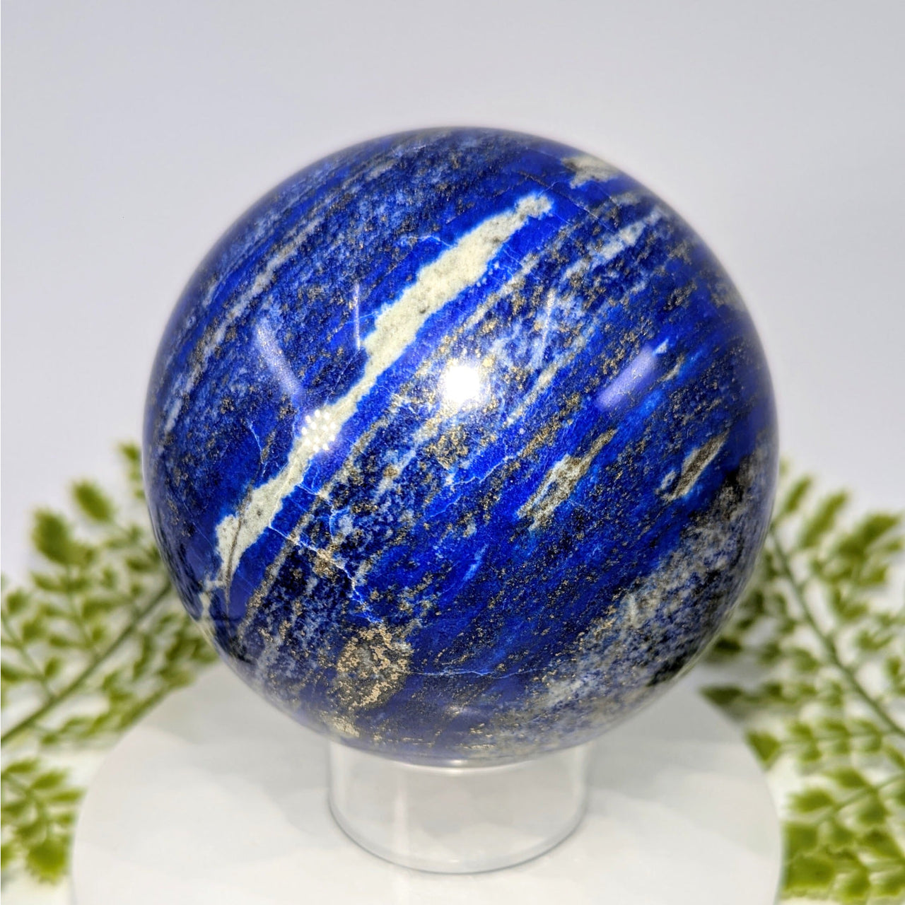 Lapis lazuli 4.25 inch sphere BC0829 with golden veining on stand