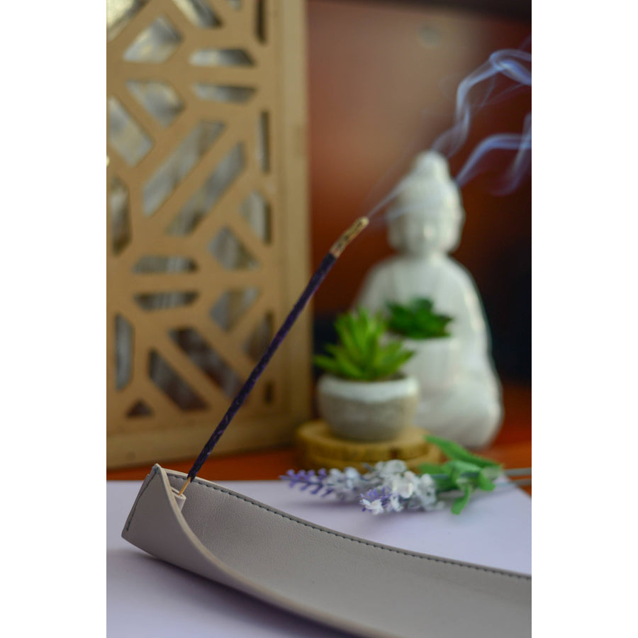 Lavender Smudge Incense Sticks burning in plastic pouch for aromatic relaxation