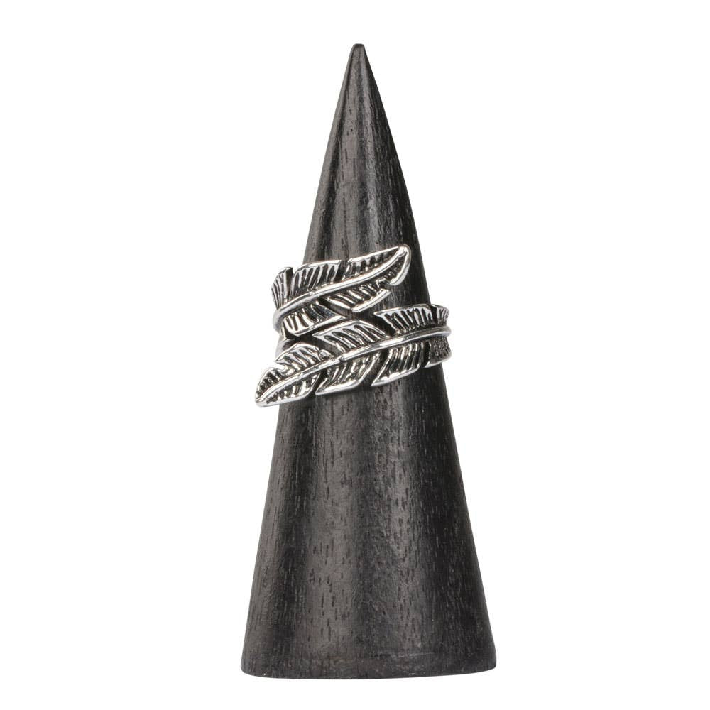 Leaf adjustable ring in silver feather design on dark wooden cone
