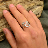 Thumbnail for A woman’s hand wearing the Leaf Cluster Sterling Silver Adj. Ring #J026