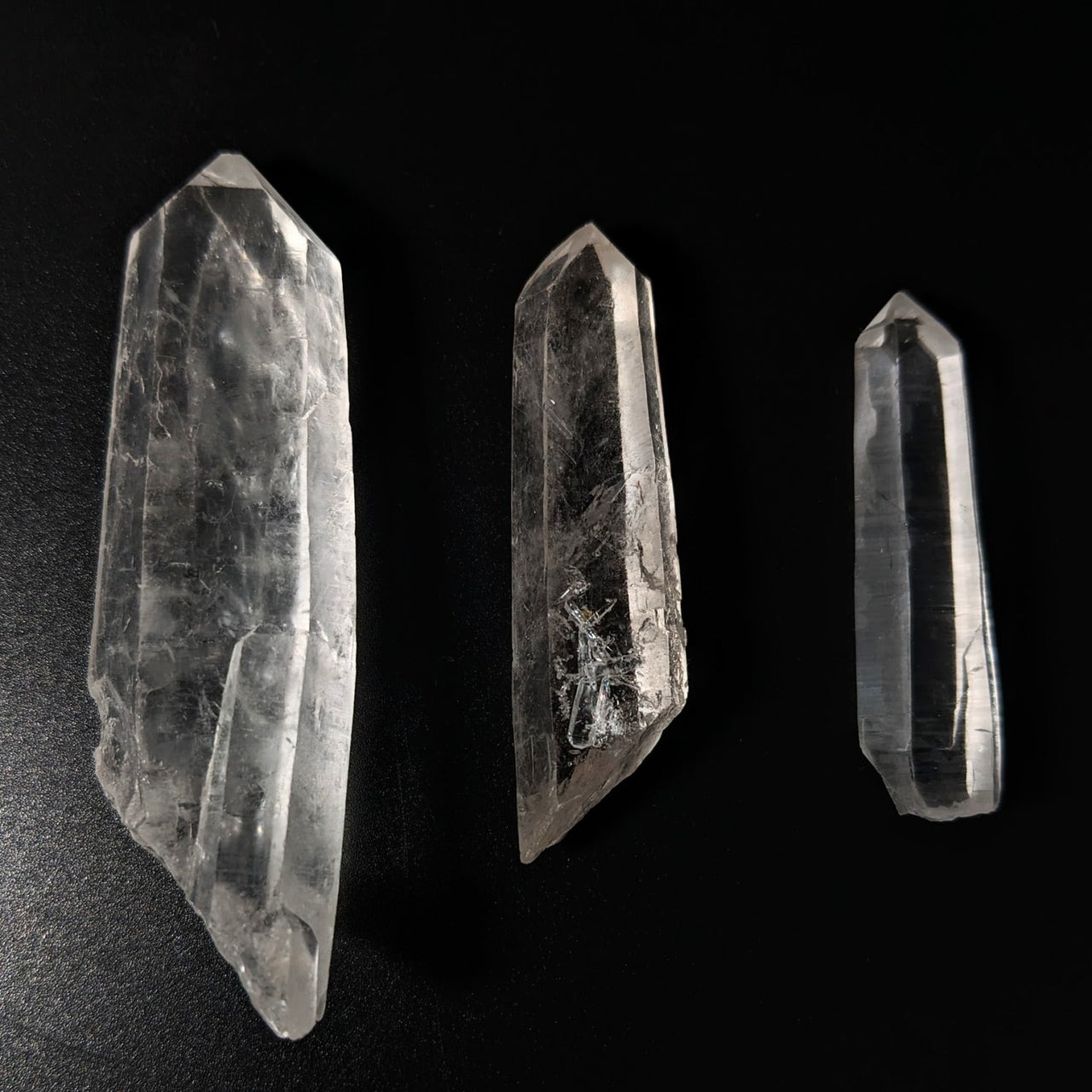 Three Lemurian Quartz Rough Points on black background - Product #LV1645