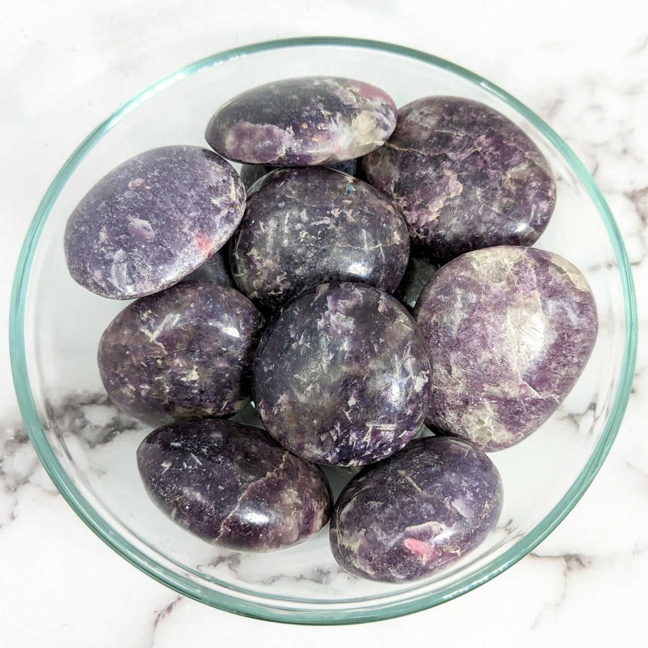 A bowl of purple marble featuring a Lepidolite with 1.6’-2’ pink tourmaline pebble #LV2003