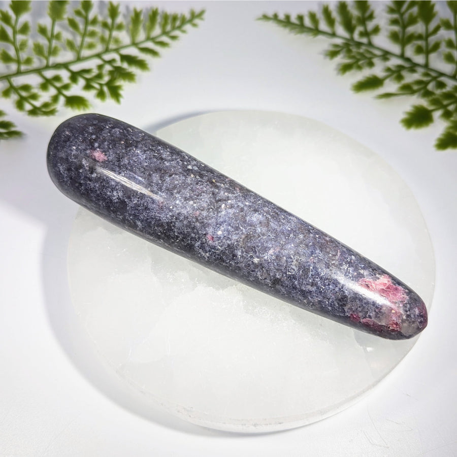 Lepidolite 5.5 inch massage wand with polished dark gray rhodonite stone featuring pink veining on clear quartz base gemstones