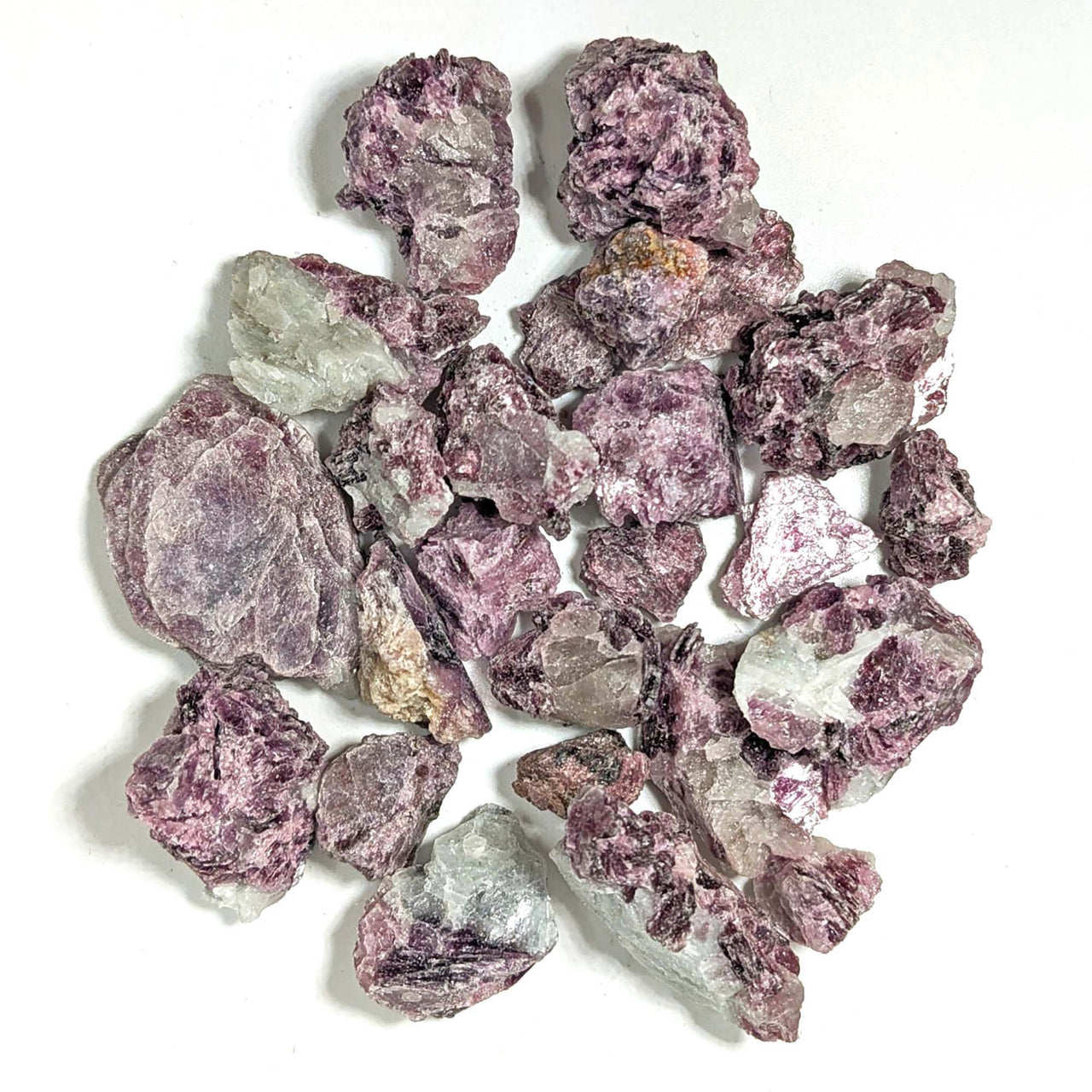 Collection of rough purple and green fluorite crystals in Lepidolite Rough 28g Parcel