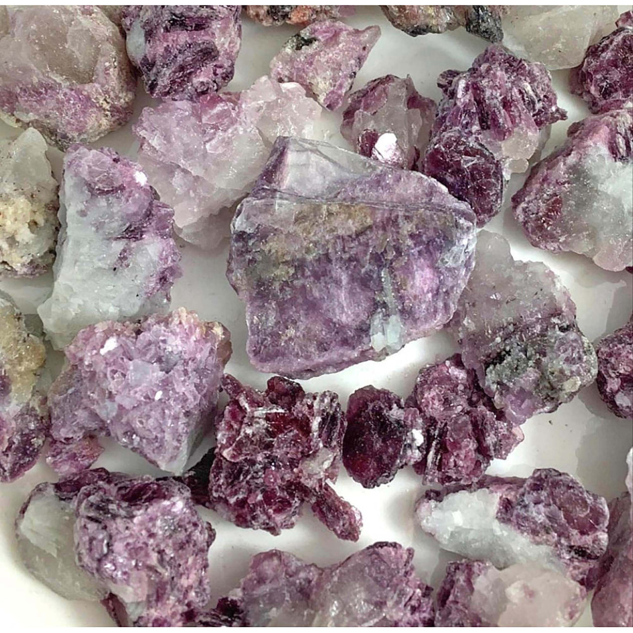 Raw lepidolite rough 28g parcel featuring purple and white crystal chunks