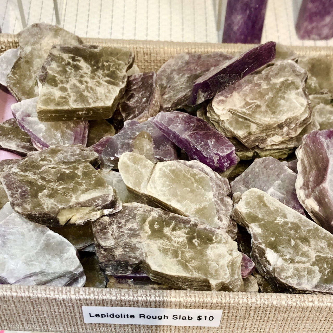 Rough chunks of purple and white Lepidolite mineral in Lepidolite Rough Slab P050