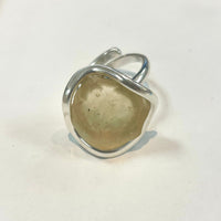 Thumbnail for Silver ring with polished amber Libyan Desert Glass stone in an organic setting