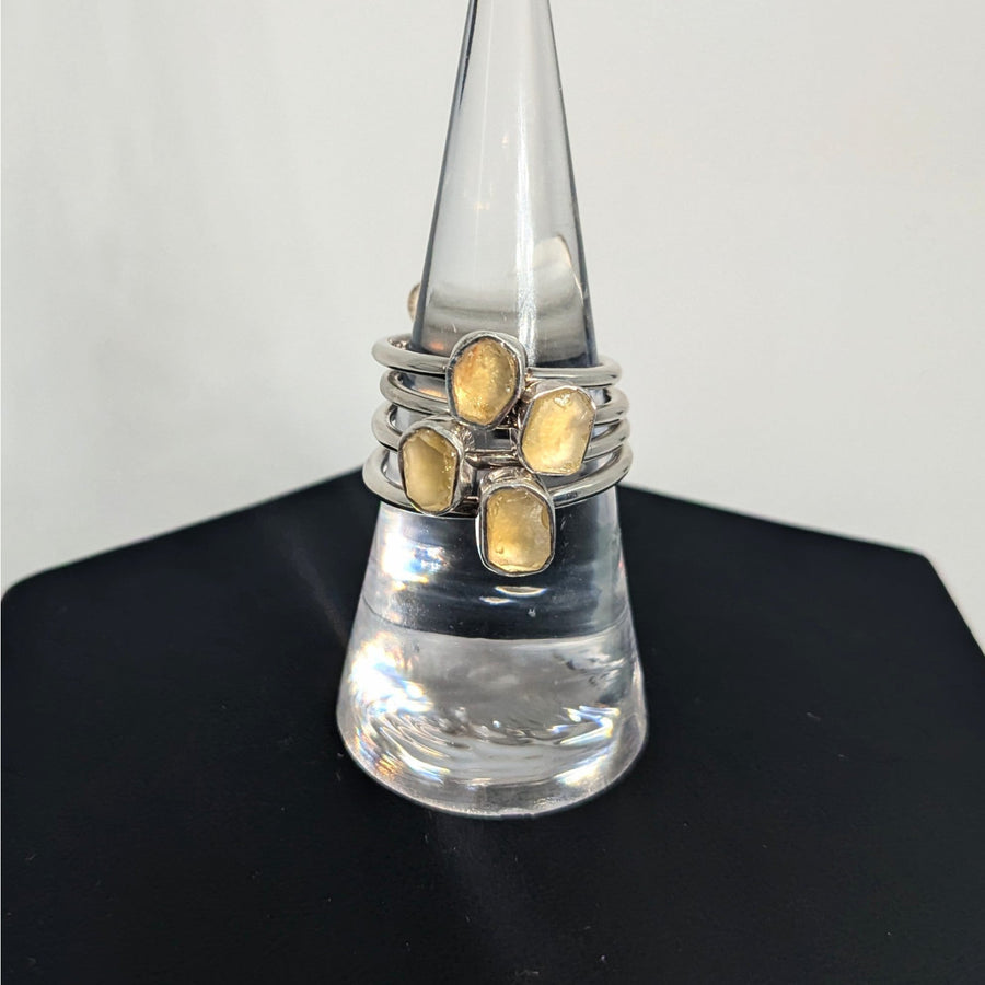 Sterling silver stacking rings with yellow citrine on clear holder, Libyan Desert Glass design