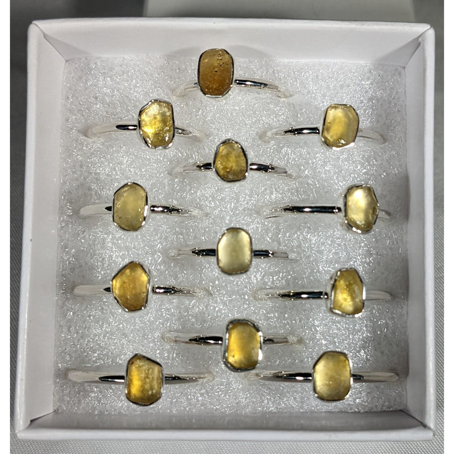 Collection of yellow Citrine gemstone rings featuring Libyan Desert Glass accents