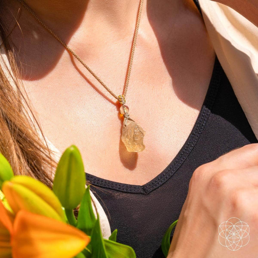 Libyan Desert Glass pendant necklace with gold leaf, orange accents