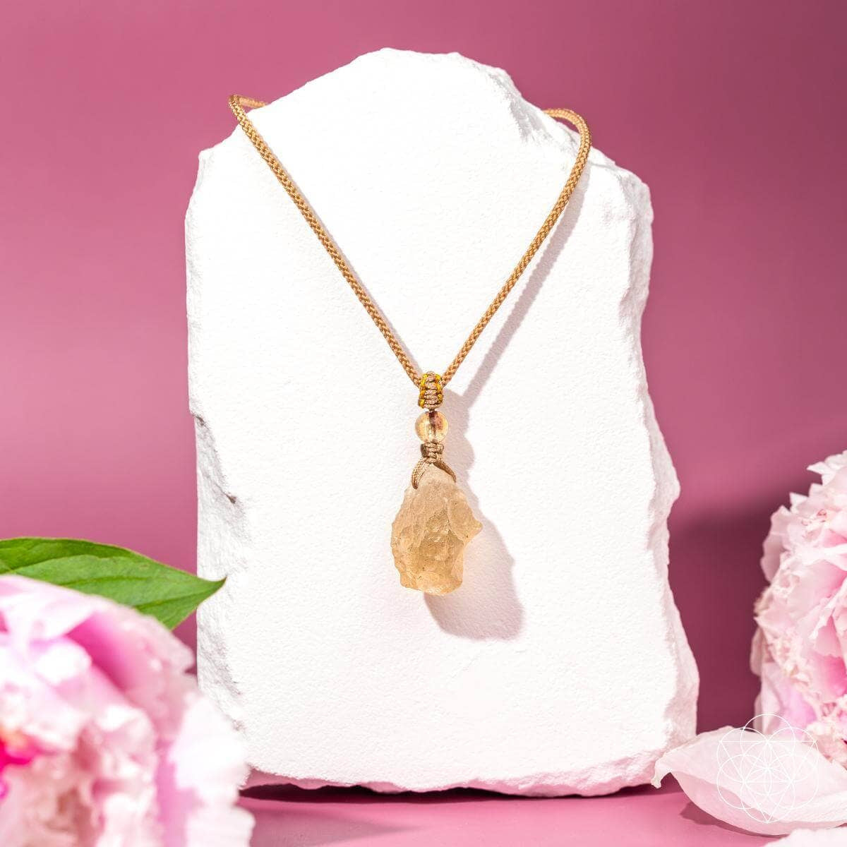 Gold raw citrine necklace with textured chain and rose-gold accents