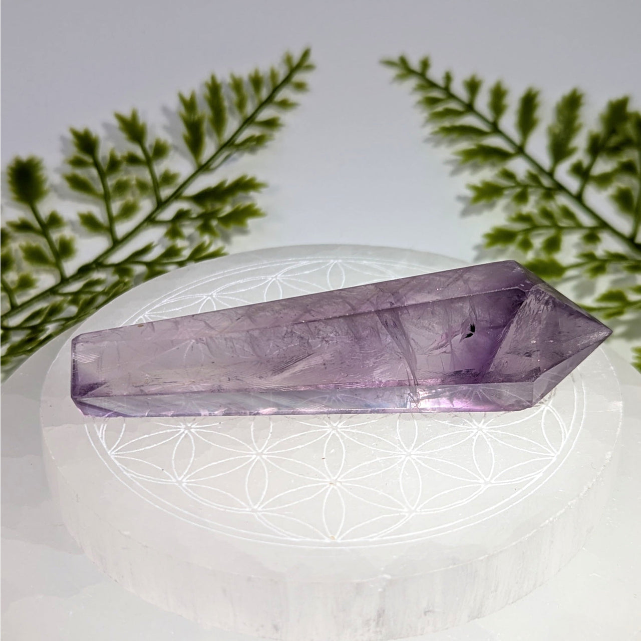 Light amethyst 3.5-inch faceted wand point #BC0860 on selenite plate