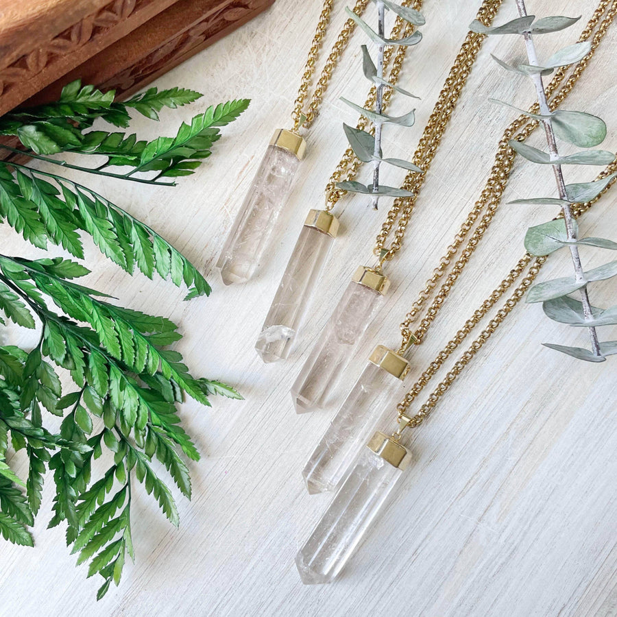 Long clear quartz 6-sided point pendant on gold chain LV9095